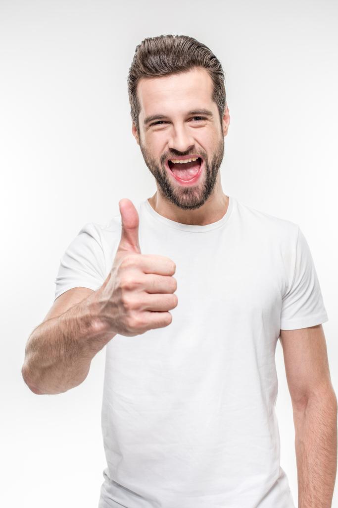 Happy young man showing thumb up isolated on white Free Stock Photo and ...