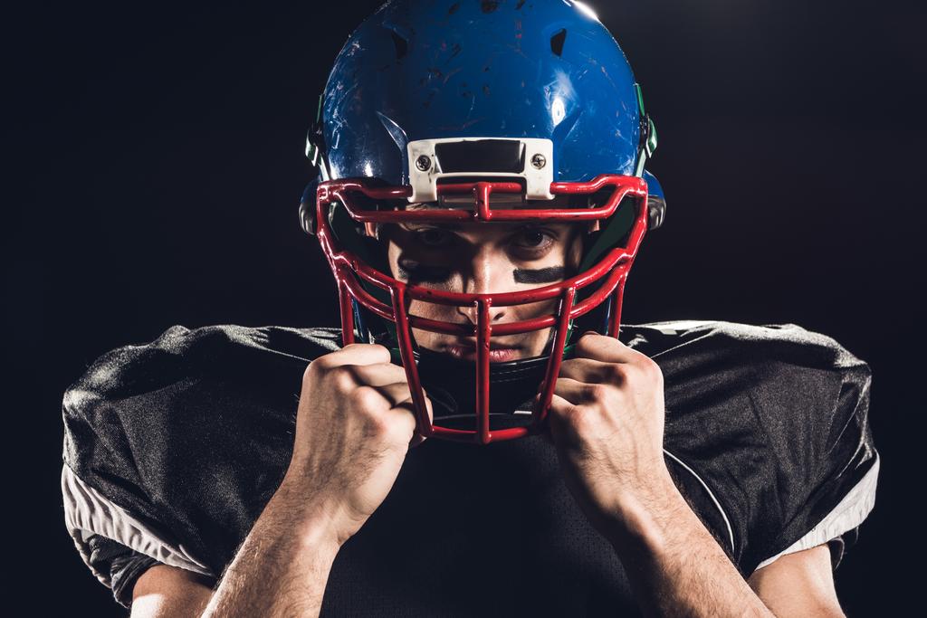 Close Up Portrait Of American Football Player In Helmet Looking At Camera Isolated On Black Free Stock Photo And Image