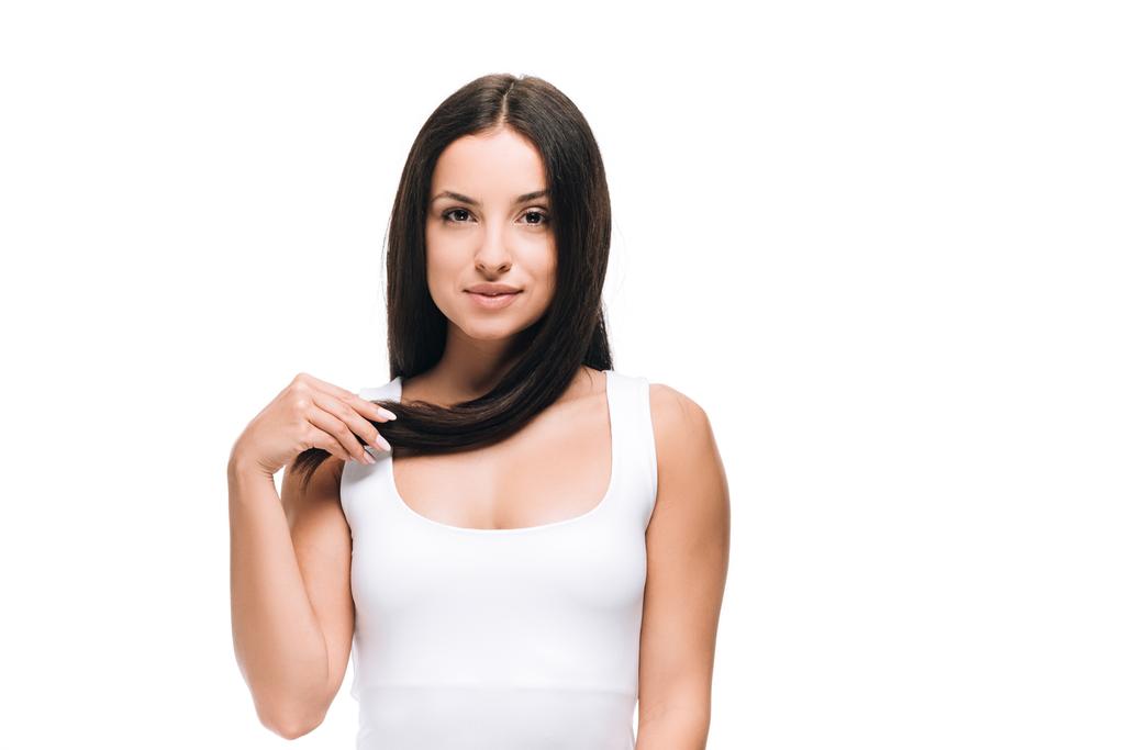 長いまっすぐな健康で光沢のある髪を持つブルネットの美しい女性は 白に隔離 ロイヤリティフリー写真 画像素材