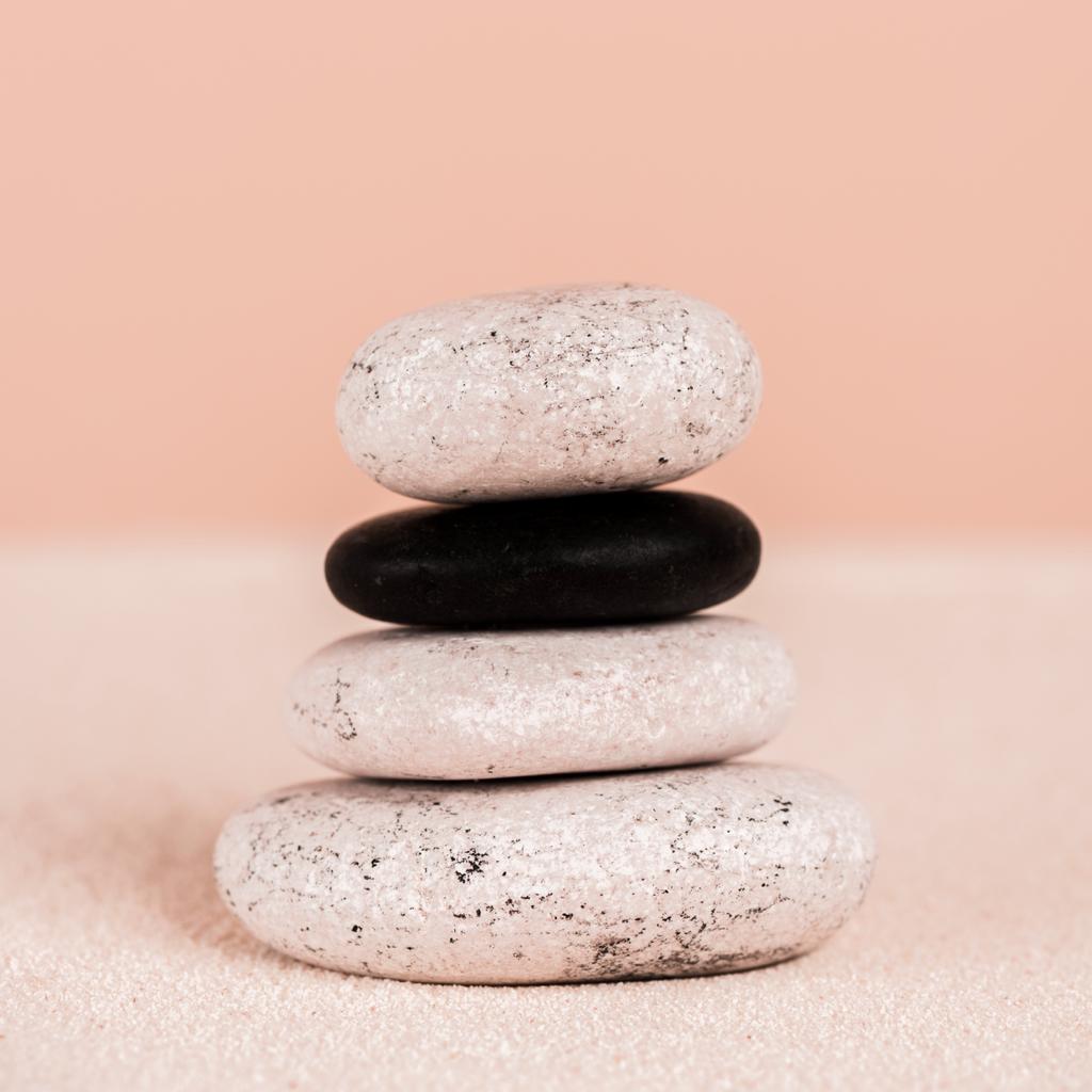 Close Up View Of Zen Stones On Sand On Peach Background Free Stock Photo And Image