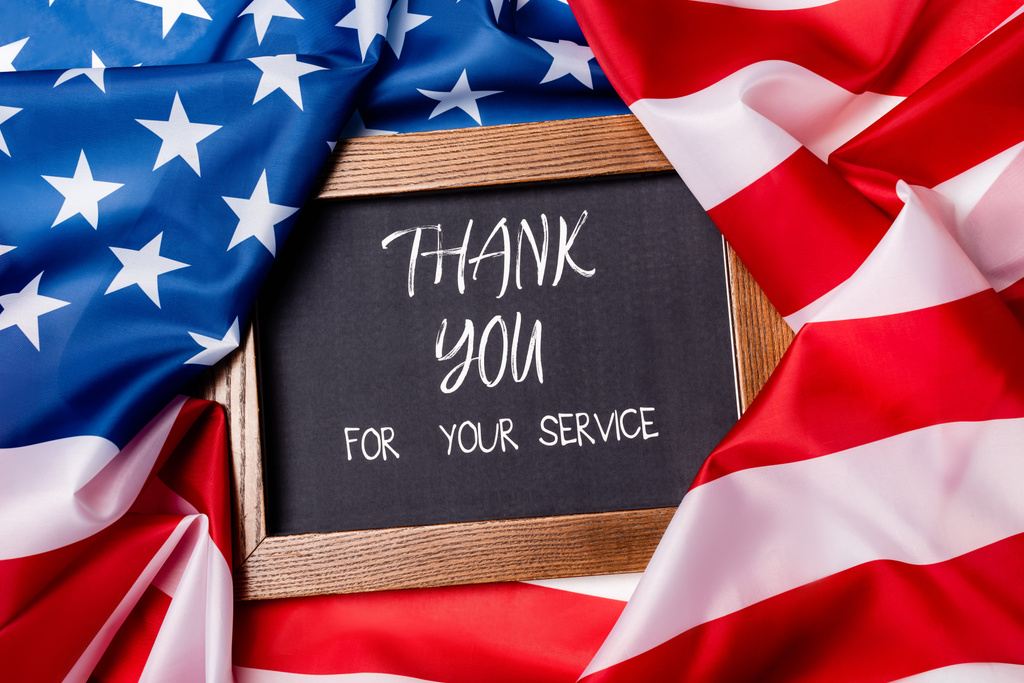Top View Of Thank You For Your Service Lettering On Chalkboard On American Flag Free Stock Photo And Image