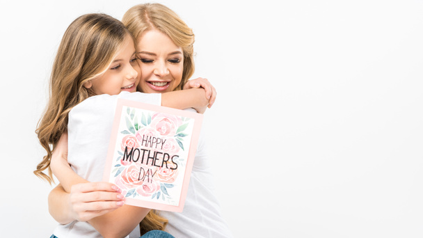 Adorable Child Hugging Smiling Mother With Happy Mothers Day Greeting Card In Hand On White Background Royalty Free Photo And Stock Image