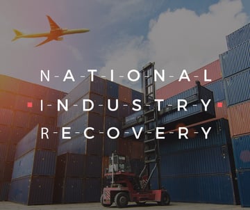 Plane Flying over Warehouse Containers